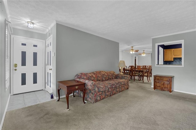 carpeted living room featuring crown molding, ceiling fan, and a textured ceiling