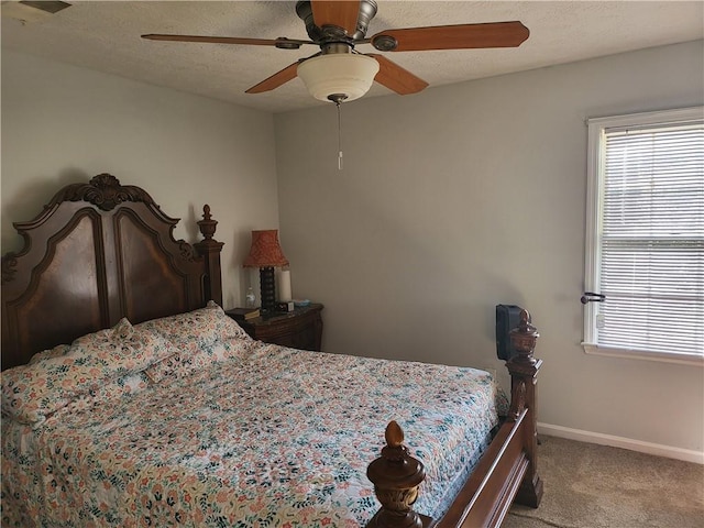 bedroom with ceiling fan and light colored carpet