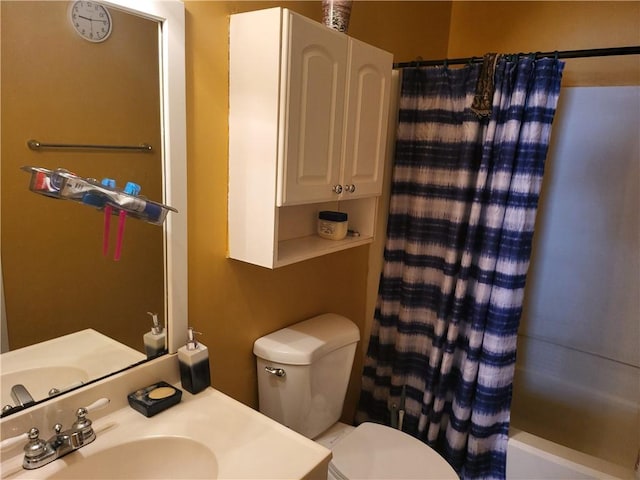 full bathroom featuring shower / bath combo, toilet, and sink