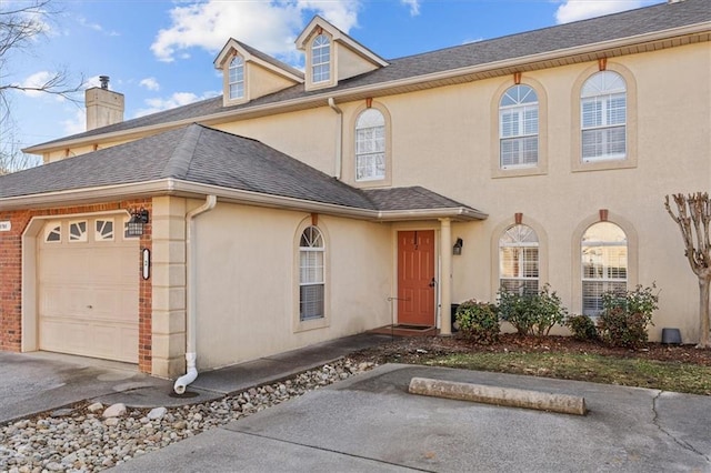 view of front of property with a garage