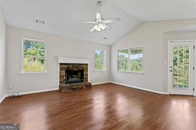 unfurnished living room featuring lofted ceiling, dark wood-style floors, visible vents, and a ceiling fan