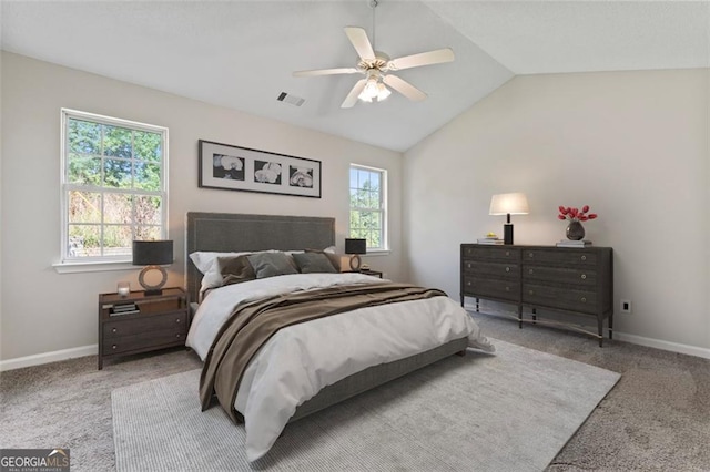 bedroom featuring lofted ceiling, carpet flooring, and multiple windows