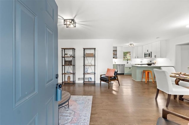 interior space with hardwood / wood-style flooring and sink