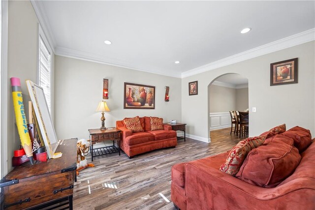 living room featuring ornamental molding and hardwood / wood-style flooring