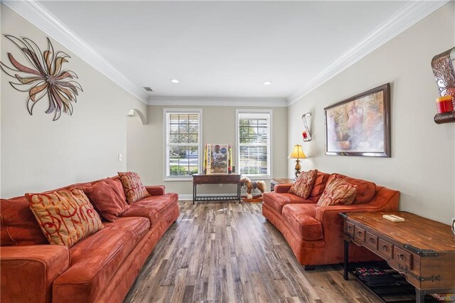 living room featuring hardwood / wood-style floors and ornamental molding