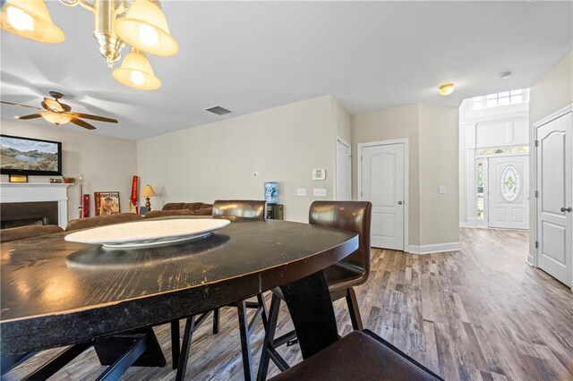 dining room featuring ceiling fan and hardwood / wood-style flooring