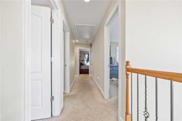 corridor with light colored carpet