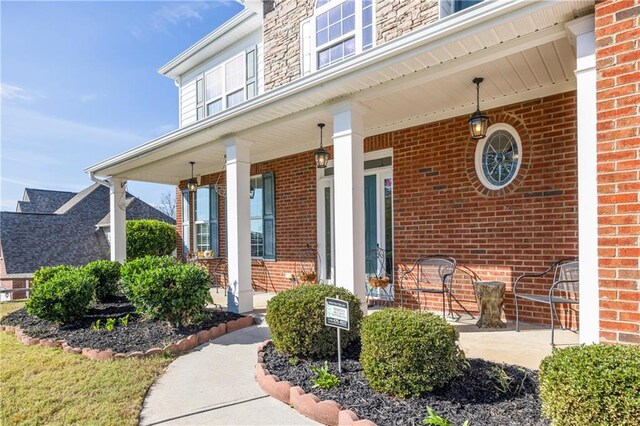 doorway to property featuring a porch