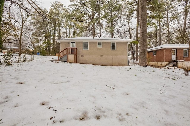 view of snow covered house