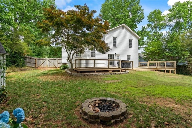 4255 Hidden Meadow Cir, Sugar Hill, GA 30518 - rear view of property with a fire pit and a wooden deck