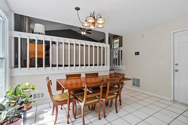 4255 Hidden Meadow Cir, Sugar Hill, GA 30518 - dining room with a chandelier, a textured ceiling, light tile patterned floors, baseboards, and lofted ceiling