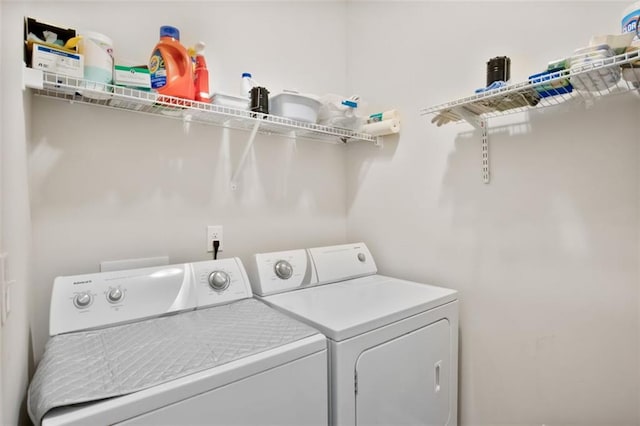 washroom with separate washer and dryer