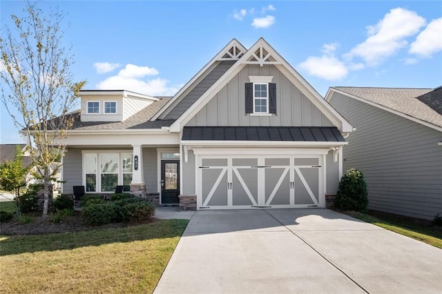 craftsman-style house with a front yard and a garage