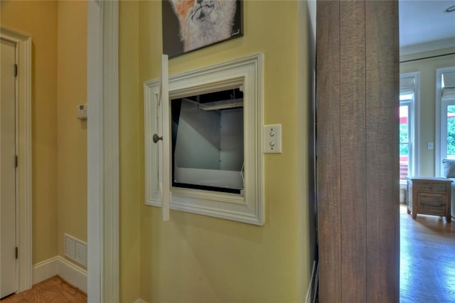 details featuring crown molding and hardwood / wood-style floors