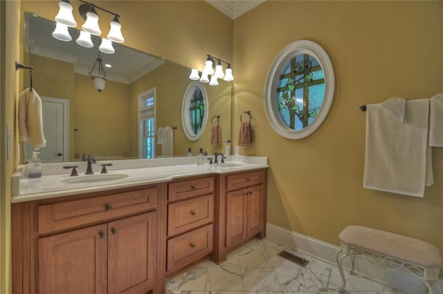 bathroom featuring ornamental molding and vanity