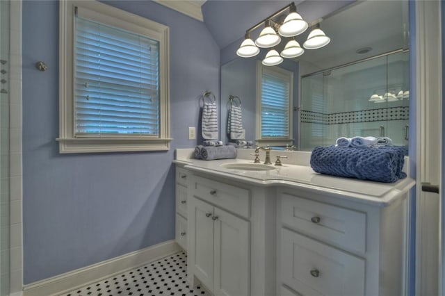 bathroom featuring an enclosed shower and vanity