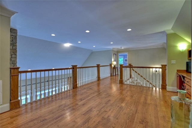 bonus room with lofted ceiling and light hardwood / wood-style flooring