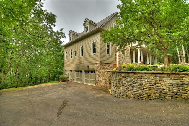 view of side of property featuring a garage