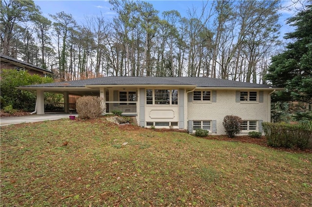 bi-level home with a carport and a front lawn