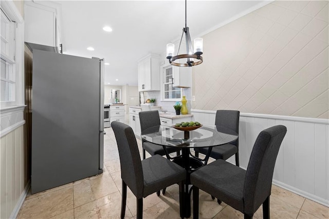 dining space with an inviting chandelier