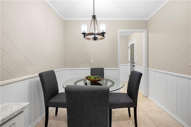 tiled dining room with ornamental molding and a chandelier
