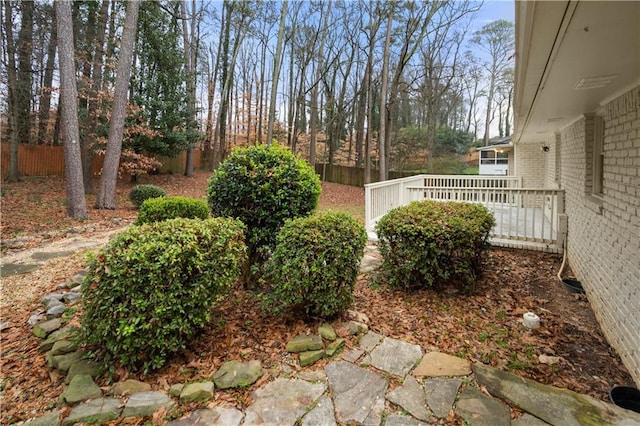 view of yard featuring a wooden deck