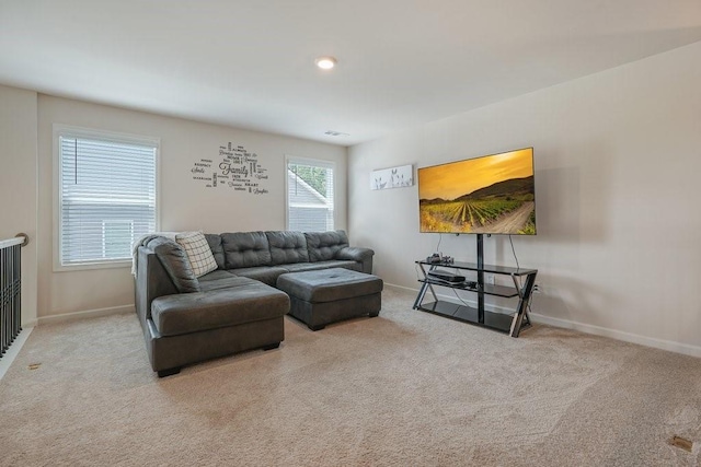 carpeted living room featuring visible vents and baseboards