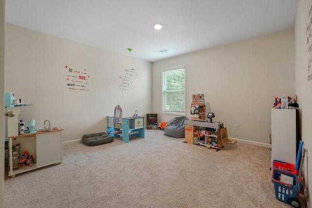 game room featuring visible vents, baseboards, and carpet flooring