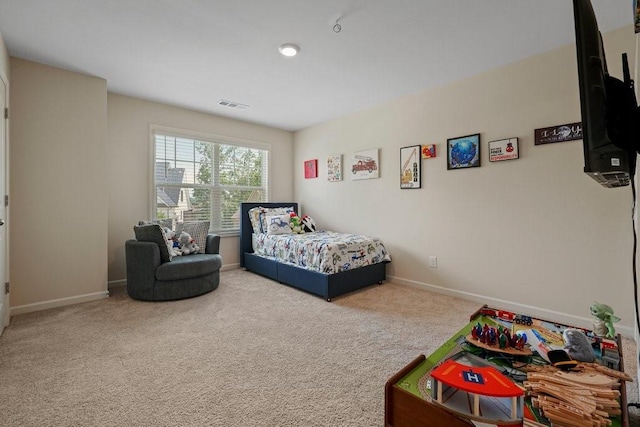 bedroom featuring visible vents, baseboards, and carpet floors