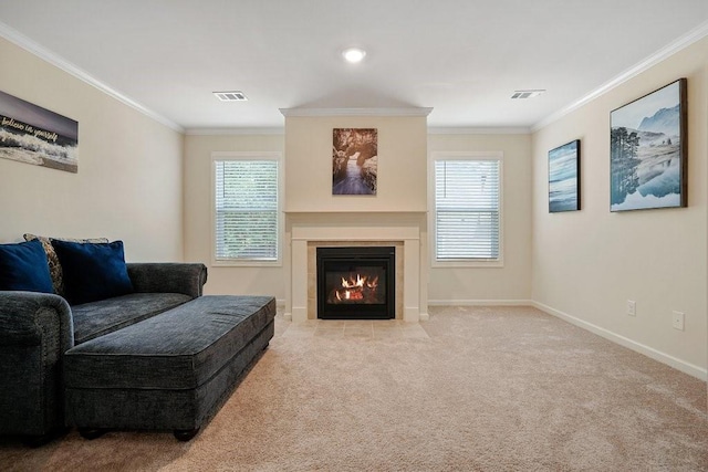 living area featuring visible vents, plenty of natural light, and ornamental molding