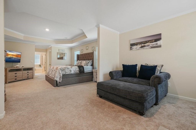 carpeted bedroom with a tray ceiling, baseboards, and ornamental molding