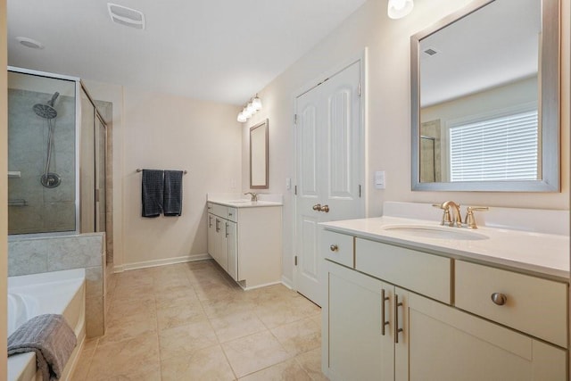 full bathroom with visible vents, a shower stall, and a sink