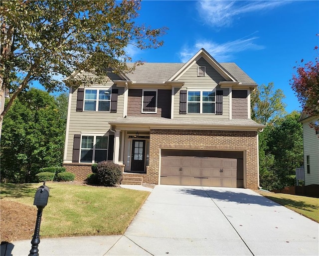 craftsman house with a front yard and a garage