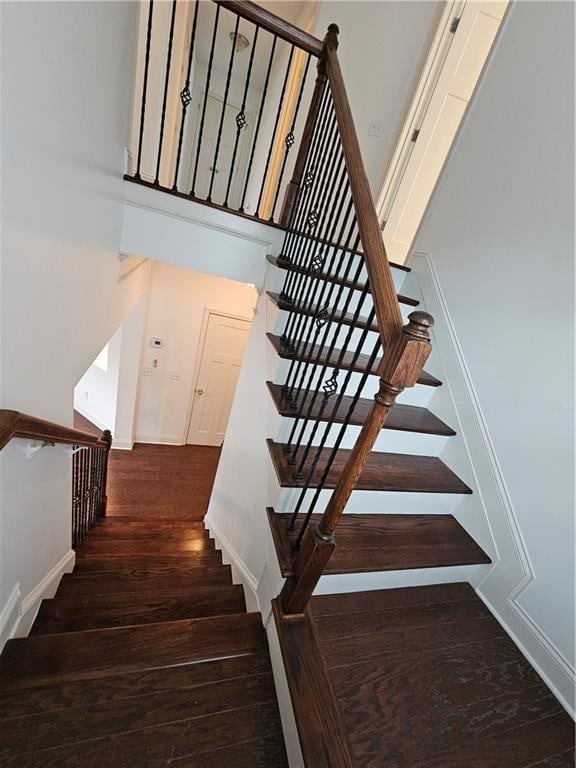 stairway featuring hardwood / wood-style floors