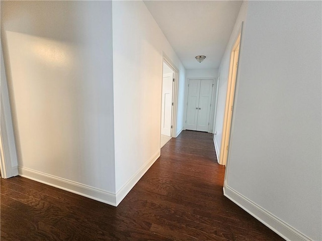 hall with dark hardwood / wood-style flooring