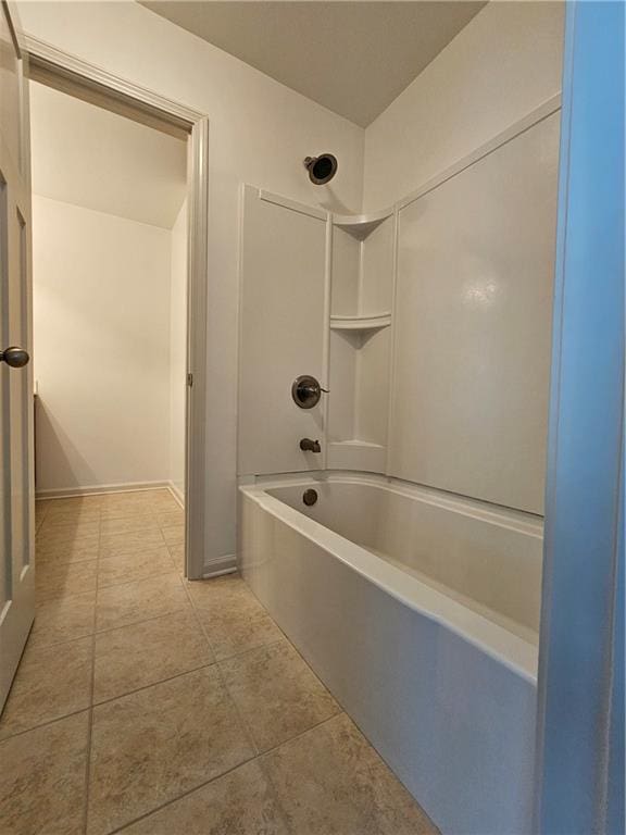 bathroom featuring tub / shower combination and tile patterned flooring