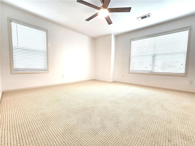 carpeted empty room with ceiling fan