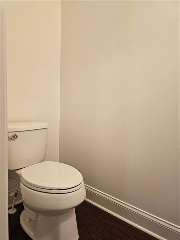 bathroom featuring toilet and hardwood / wood-style floors