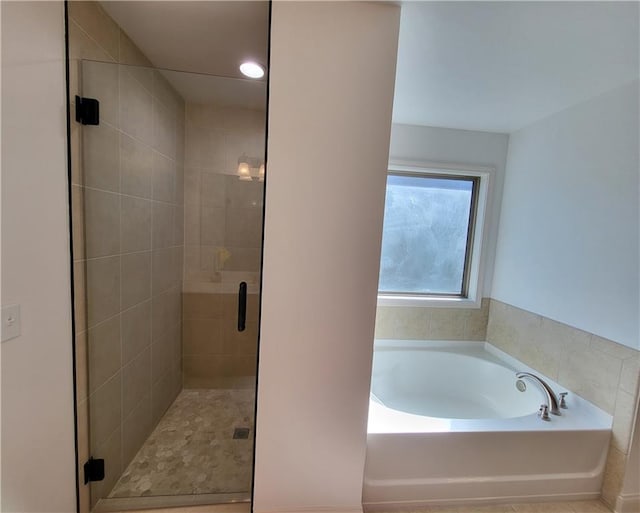 bathroom featuring plus walk in shower