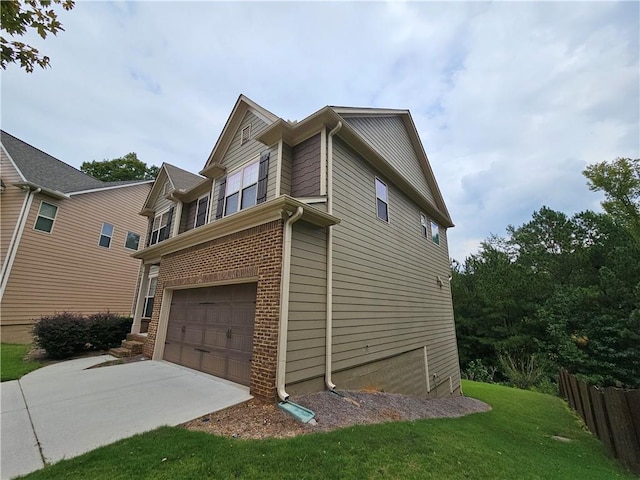 view of home's exterior featuring a garage and a lawn