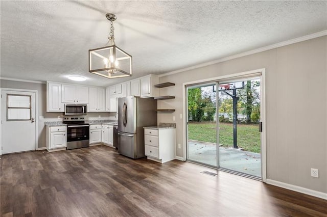 kitchen featuring white cabinets, pendant lighting, stainless steel appliances, and ornamental molding