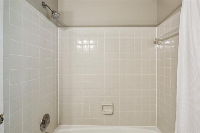 bathroom featuring shower / bath combination with curtain