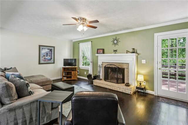 living area featuring baseboards, ceiling fan, and hardwood / wood-style floors