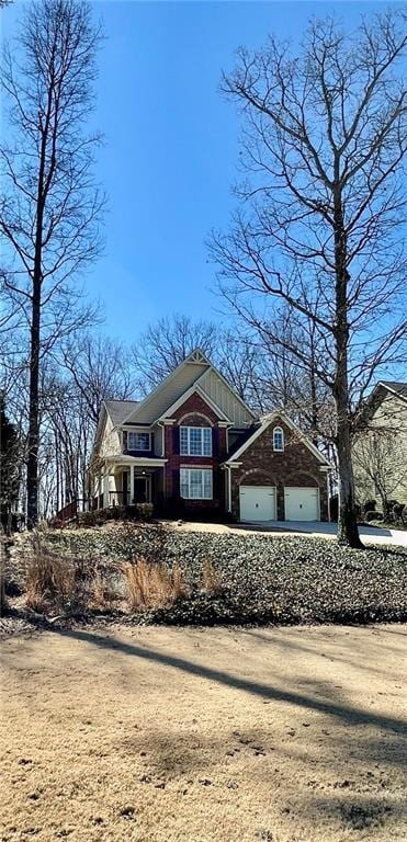 view of front facade featuring driveway and an attached garage