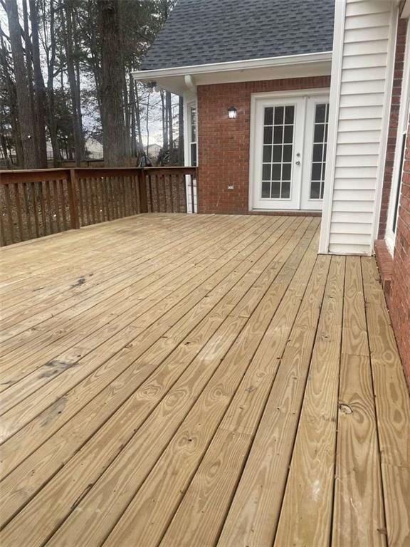 wooden deck featuring french doors