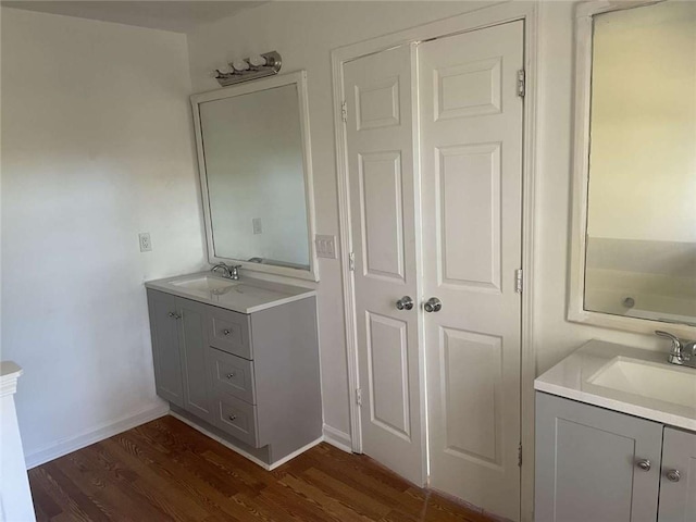 bathroom with vanity and hardwood / wood-style flooring