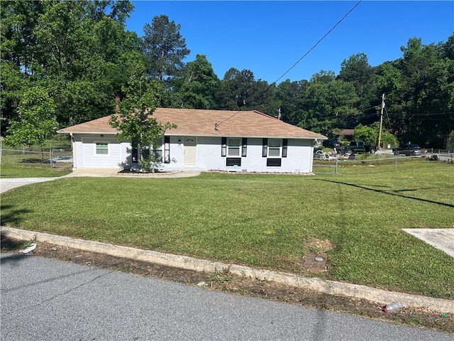 2875 Carriage Ln, Atlanta, GA 30349 - ranch-style home with fence and a front yard