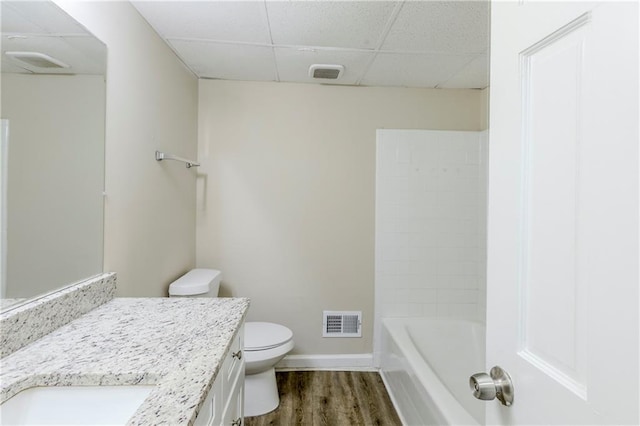 3225 Redona Dr, Atlanta, GA 30349 - bathroom with toilet, vanity, hardwood / wood-style floors, and a drop ceiling