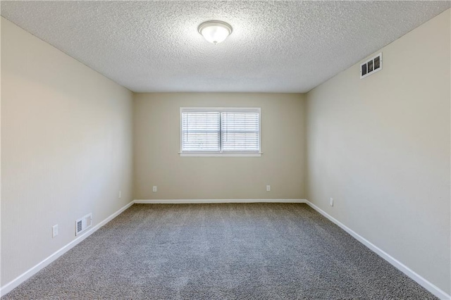 3225 Redona Dr, Atlanta, GA 30349 - spare room with carpet floors and a textured ceiling