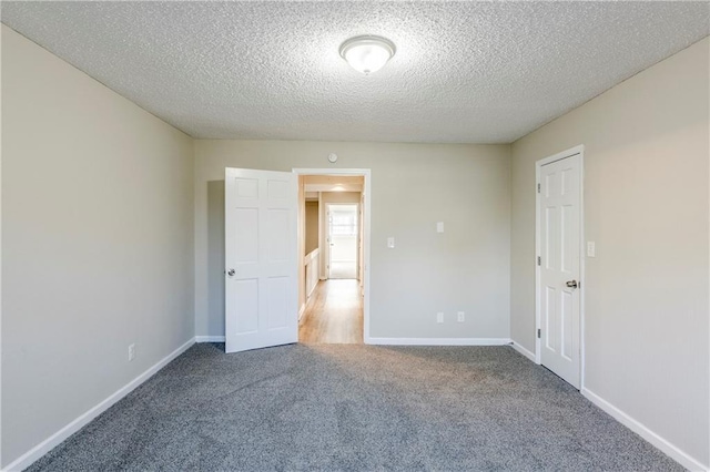 3225 Redona Dr, Atlanta, GA 30349 - empty room with carpet floors and a textured ceiling